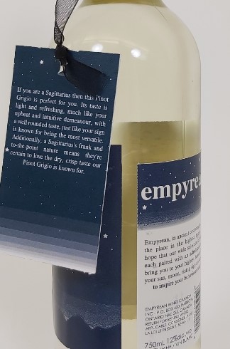 Our label was designed with the application in mind, setting the space in printing the two labels for the right bottle dimension so that there is equidistance betwixt each label's start and end. The tag was digitally printed, affixed with a matching ribbon.